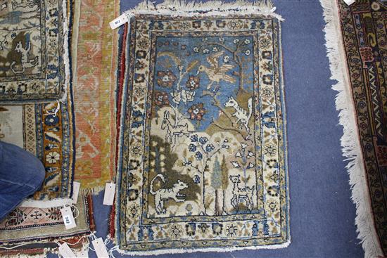 A pair of Persian blue ground small mats, decorated with animals amongst trees and flowers, and three other mats with stylised floral